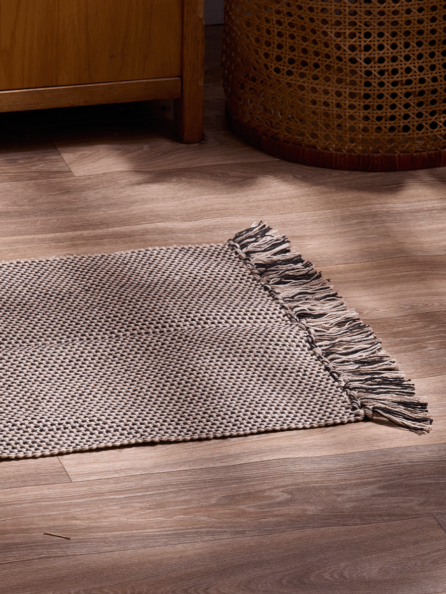 Small Beige And Black Rug